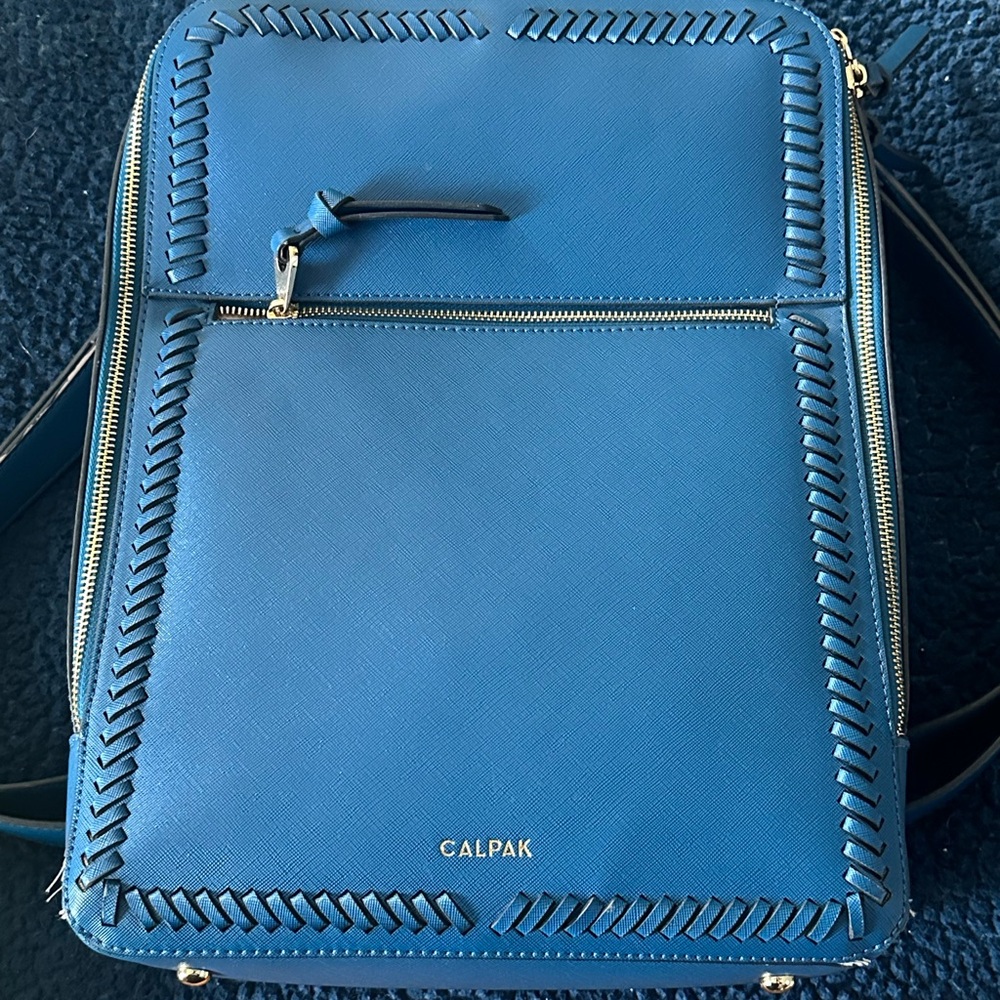 Classy, beautiful blue Calpak, backpack, laptop bag.